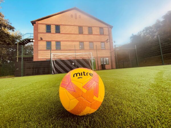 Sports lessons at Coombswood Special Educational Needs school in Dudley, take place on the purpose built astro turf area, which has been designed to allow safe sports participation.