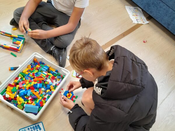 Learners at Coombswood SEN School participating in a Lego therapy session. Lego Therapy is a collaborative, play-based social skills intervention. It is designed to improve social language or social communication difficulties