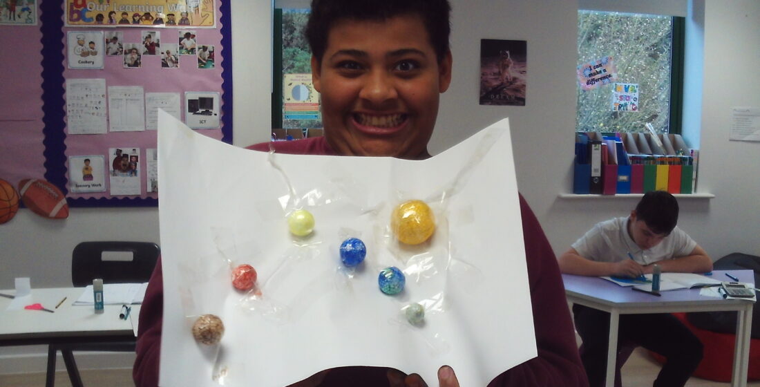 Coombswood School learners creating their own planets and a model of the solar system to explore space and science through hands-on activities.