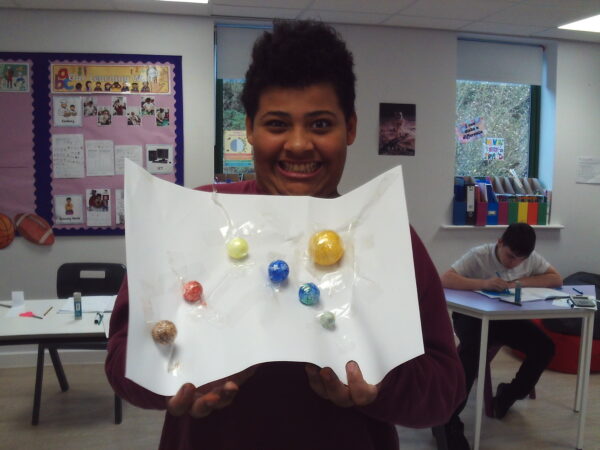 Coombswood School learners creating their own planets and a model of the solar system to explore space and science through hands-on activities.