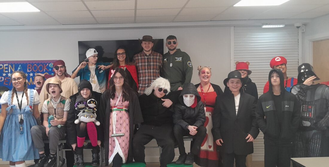 Learners and staff at Coombswood School celebrate World Book Day in costume, enjoying creative reading activities.