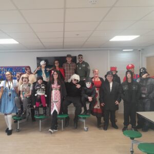 Learners and staff at Coombswood School celebrate World Book Day in costume, enjoying creative reading activities.