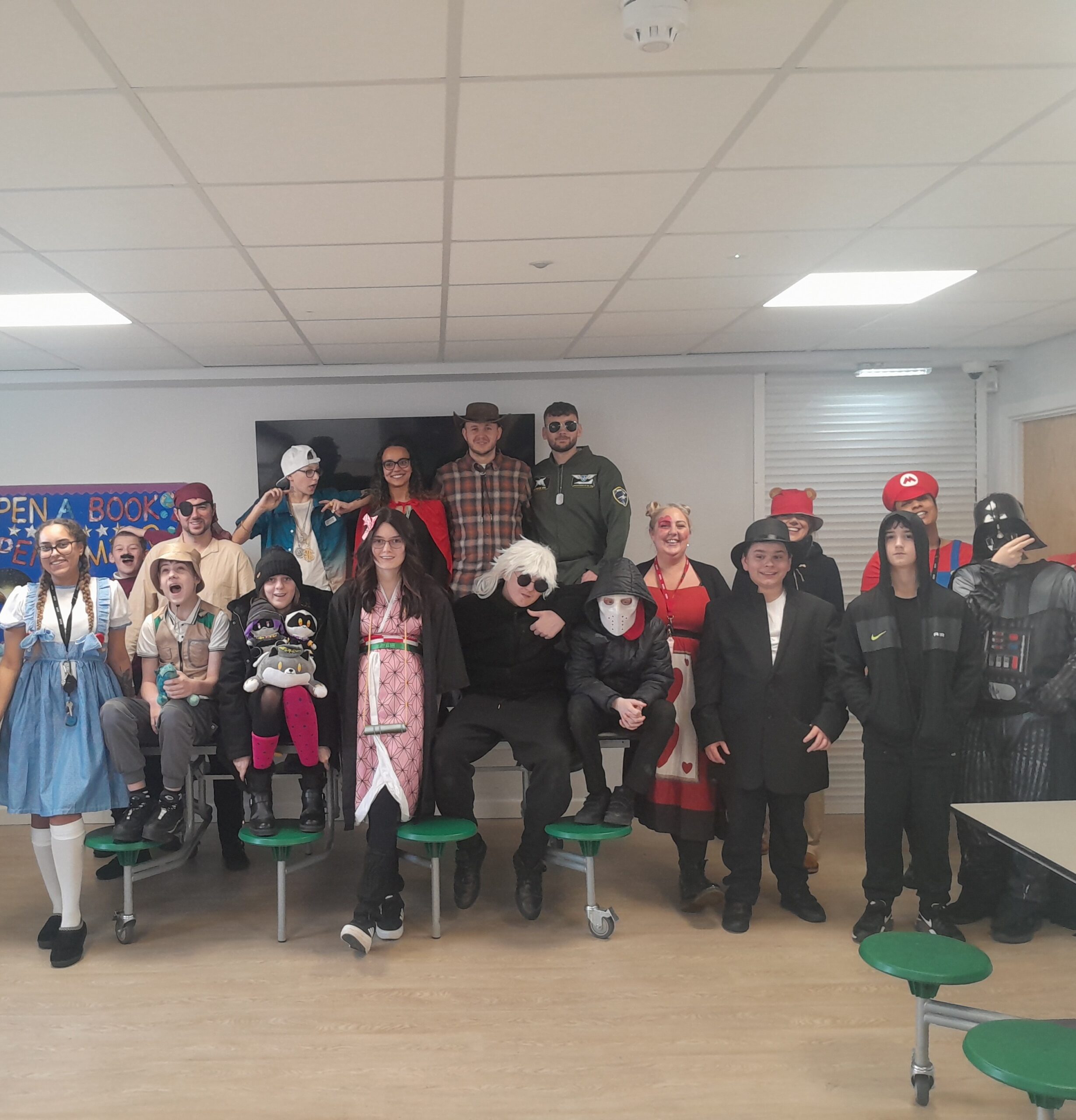 Learners and staff at Coombswood School celebrate World Book Day in costume, enjoying creative reading activities.